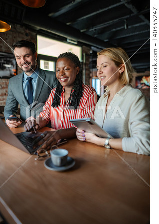 Diverse business people collaborating in modern coworking space 140355247