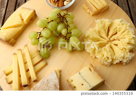 Gourmet Cheese Board with Grapes Morbier  Moine and Gruyere 140355319