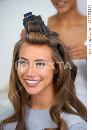 Face, smile and hair curlers with woman in salon for professional shampoo or keratin treatment. Beauty, makeup and haircare with happy young model backstage or behind the scenes for cosmetic makeover Face, smile and hair curlers with woman in salon for professional shampoo or keratin treatment. Beauty, makeup and haircare with happy young model backstage or behind the scenes for cosmetic makeover 140355532