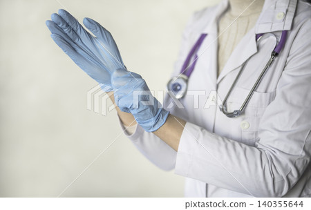 woman doctor wears medical gloves. medical concept 140355644