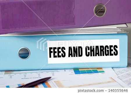 A lignt blue folder with the label FEES AND CHARGES. A lignt blue folder with the label FEES AND CHARGES. 140355646
