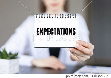 Hand writing inscription Expectations on notebook, business concept Hand writing inscription Expectations on notebook, business concept 140355654