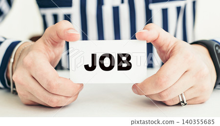 JOB. Woman holding a card with a message text written on it. JOB. Woman holding a card with a message text written on it. 140355685