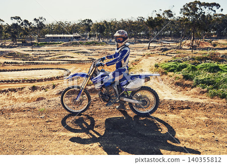 Man, motorbike and outdoor on trail for portrait with helmet on dirt, path and countryside in summer. Person, motorcycle and gravel on road with vehicle, machine and fast transport in competition 140355812