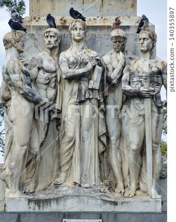 Cordoba, Argentina - April 11, 2026: Sculptural group at the base of the Dante Monument Cordoba, Argentina - April 11, 2026: Sculptural group at the base of the Dante Monument 140355897