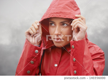 Woman, rain jacket and hood with weather for cloudy sky, winter season or outdoor storm. Face of female person with red waterproof coat and looking up at rainy overcast for cold, protection or fog Woman, rain jacket and hood with weather for cloudy sky, winter season or outdoor storm. Face of female person with red waterproof coat and looking up at rainy overcast for cold, protection or fog 140356000