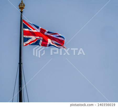 a majestic flag flutters over the Westminster Tower a majestic flag flutters over the Westminster Tower 140356019