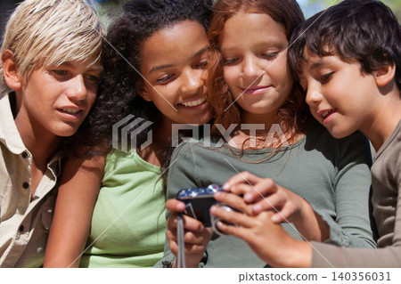 Children, friends and check camera with picture for social media, photography and scroll for memory. Photograph, technology and together outdoor on holiday or vacation with photoshoot of kids Children, friends and check camera with picture for social media, photography and scroll for memory. Photograph, technology and together outdoor on holiday or vacation with photoshoot of kids 140356031