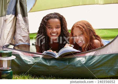Reading, smile and children in tent on camp with a book for literature entertainment together. Happy, friends and portrait of girl kids enjoying a novel or story for knowledge on holiday or vacation. 140356052