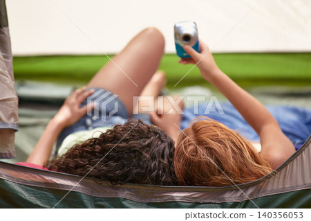 Camping, tent and friends with camera for selfie, memory and relax together on vacation. Back, head and children capture photography with tech on holiday, adventure or casual moment outdoor in summer Camping, tent and friends with camera for selfie, memory and relax together on vacation. Back, head and children capture photography with tech on holiday, adventure or casual moment outdoor in summer 140356053