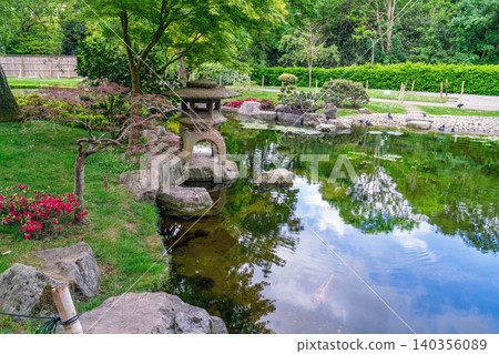 Scenic landscape view of Kyoto Garden in Holland Park, West London, during a sunny spring day. Scenic landscape view of Kyoto Garden in Holland Park, West London, during a sunny spring day. 140356089