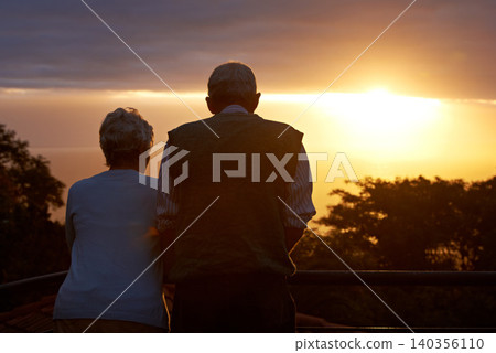 Senior couple, sunset and view on balcony in outdoors, bonding and love on vacation or holiday. Back, elderly people and dusk on terrace and together in nature, security and travel for marriage Senior couple, sunset and view on balcony in outdoors, bonding and love on vacation or holiday. Back, elderly people and dusk on terrace and together in nature, security and travel for marriage 140356110