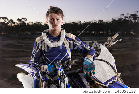 Sport, portrait and man with off road motorbike, confidence and gear for competition, race or challenge. Adventure, adrenaline and serious face of athlete on extreme course with dirt bike in evening Sport, portrait and man with off road motorbike, confidence and gear for competition, race or challenge. Adventure, adrenaline and serious face of athlete on extreme course with dirt bike in evening 140356138
