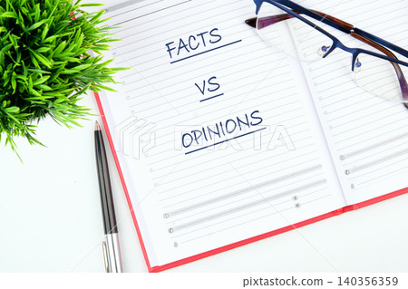 On a clean desk, a notebook displays the words facts vs opinions. Beside it, a pair of glasses rests alongside a sleek pen, encouraging thoughtful exploration On a clean desk, a notebook displays the words facts vs opinions. Beside it, a pair of glasses rests alongside a sleek pen, encouraging thoughtful exploration 140356359