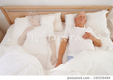 Sleeping, ghost and senior man in bed, depression and ghost of wife or spouse in bedroom. Elderly male person, mental health and dream at home, spirit and haunted by lonely or past memory in nap 140356484