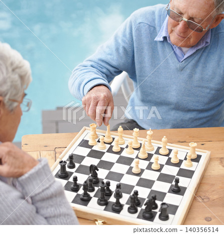 Senior, couple and game of chess outdoor together in retirement with competition of strategy. Thinking, challenge and elderly man and woman with activity or contest on board for holiday or vacation Senior, couple and game of chess outdoor together in retirement with competition of strategy. Thinking, challenge and elderly man and woman with activity or contest on board for holiday or vacation 140356514