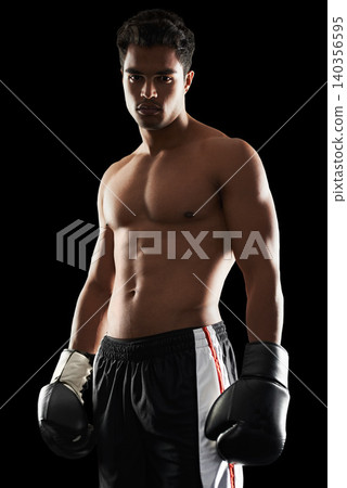 Portrait, man and boxer in studio for sports, training and workout for healthy body isolated on a black background. Fighter, serious athlete and person with gloves for fitness or exercise in Brazil Portrait, man and boxer in studio for sports, training and workout for healthy body isolated on a black background. Fighter, serious athlete and person with gloves for fitness or exercise in Brazil 140356595