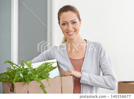 Portrait, new home and woman with boxes, smile and real estate with rental apartment and excited. Person, plant and girl with achievement and personal development with package and property on a loan Portrait, new home and woman with boxes, smile and real estate with rental apartment and excited. Person, plant and girl with achievement and personal development with package and property on a loan 140356677
