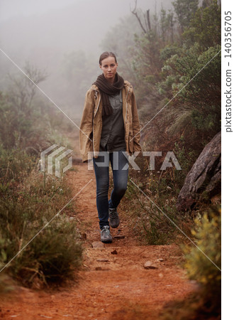 Portrait, hiking and woman in nature for travel, wellness or morning walk outdoor in winter. Path, trekking and female person in a forest for fresh air, camping or adventure, journey or discovery Portrait, hiking and woman in nature for travel, wellness or morning walk outdoor in winter. Path, trekking and female person in a forest for fresh air, camping or adventure, journey or discovery 140356705