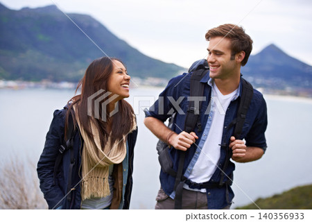 Hiking, nature and couple on mountain laugh with backpack for love, trekking and explore landscape. Travel, dating and happy man and woman by scenic view on holiday, vacation and outdoor adventure Hiking, nature and couple on mountain laugh with backpack for love, trekking and explore landscape. Travel, dating and happy man and woman by scenic view on holiday, vacation and outdoor adventure 140356933