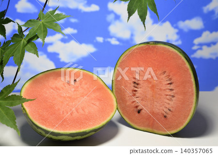 Sliced watermelon against a blue sky Sliced watermelon against a blue sky 140357065