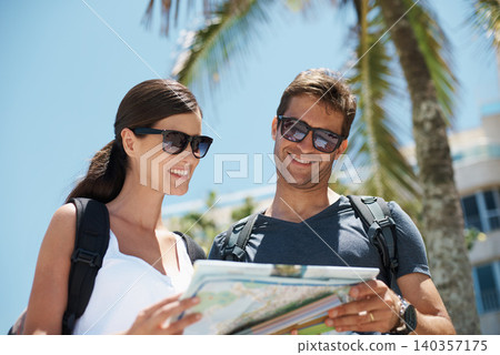 Couple, map and search by palm tree on vacation, street and excited for giving direction. Woman, man and chart for location, landmark and travel for memory with buildings, nature or thinking in Italy Couple, map and search by palm tree on vacation, street and excited for giving direction. Woman, man and chart for location, landmark and travel for memory with buildings, nature or thinking in Italy 140357175