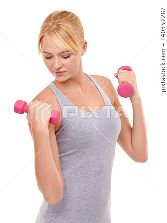 Sport, weights and woman athlete in studio for health, wellness and body workout or training. Energy, fitness and young female person with dumbbell equipment for exercise isolated by white background Sport, weights and woman athlete in studio for health, wellness and body workout or training. Energy, fitness and young female person with dumbbell equipment for exercise isolated by white background 140357282