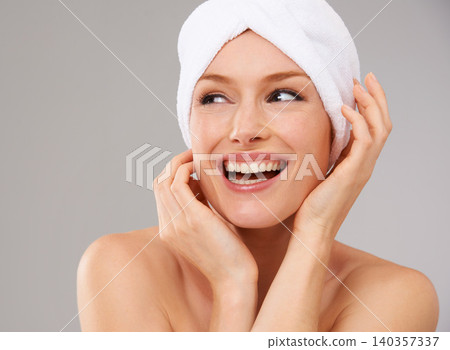 Happy, woman and thinking about skincare for beauty and healthy dermatology in studio background. Girl, smile and model laughing with glow on skin from facial, cosmetics or towel for self care Happy, woman and thinking about skincare for beauty and healthy dermatology in studio background. Girl, smile and model laughing with glow on skin from facial, cosmetics or towel for self care 140357337