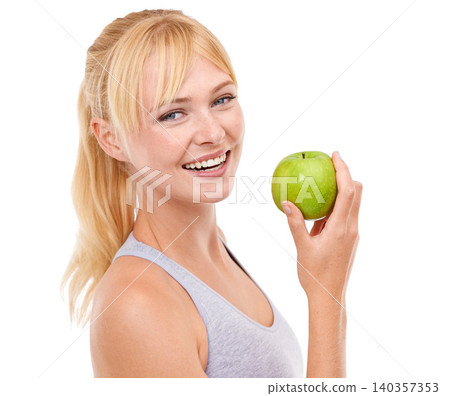 Studio, portrait and woman with apple for health, vegan and nutrition benefits for wellness. Fruit, face and happy female person with food for vitamin c, detox and clean gut on white background Studio, portrait and woman with apple for health, vegan and nutrition benefits for wellness. Fruit, face and happy female person with food for vitamin c, detox and clean gut on white background 140357353