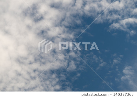 Clouds fill sky. Plush sky with thick clouds. Puffy atmospheric layers with dense cloud groups. Softly shaded voluminous cloud formations spanning expansive sky Clouds fill sky. Plush sky with thick clouds. Puffy atmospheric layers with dense cloud groups. Softly shaded voluminous cloud formations spanning expansive sky 140357363