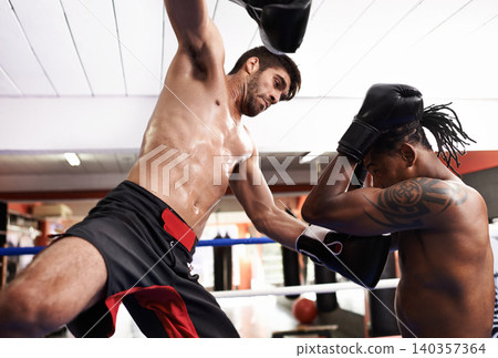 Men, kickboxing and match for fight in gym, fitness and topless for exercise and workout. People, bodybuilders and performance for challenge or practice, train and attack in competition for sports Men, kickboxing and match for fight in gym, fitness and topless for exercise and workout. People, bodybuilders and performance for challenge or practice, train and attack in competition for sports 140357364