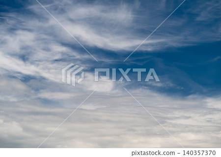 Peaceful sky vista. Quiet sky with gentle clouds. Serene atmosphere under multilayered cloud canopy. Calm and tranquil celestial scene with soft sunlight and distant horizons Peaceful sky vista. Quiet sky with gentle clouds. Serene atmosphere under multilayered cloud canopy. Calm and tranquil celestial scene with soft sunlight and distant horizons 140357370