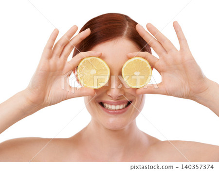 Woman, skincare and hand with lemon in studio for organic, beauty and hydration benefit on white background. Dermatology, cosmetics and smile with citrus fruit for vitamin c, glow and self care 140357374