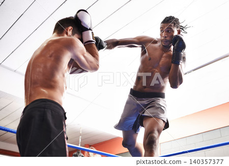 Men, kickboxing and jumping for fight in ring, fitness and topless for exercise and workout. People, bodybuilders and performance for challenge or practice, train and combat for competition in sports Men, kickboxing and jumping for fight in ring, fitness and topless for exercise and workout. People, bodybuilders and performance for challenge or practice, train and combat for competition in sports 140357377