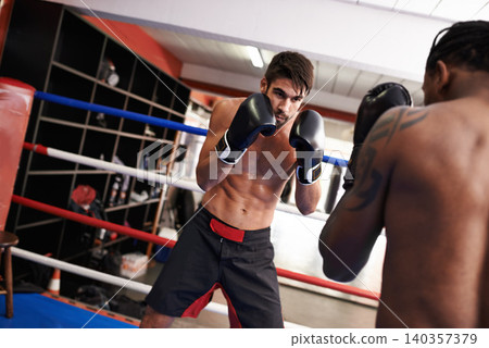 Men, fighting and boxing ring for competition practice in gym for endurance development, performance or training. Male people, gear and combat sport together for cardio battle, defence or workout Men, fighting and boxing ring for competition practice in gym for endurance development, performance or training. Male people, gear and combat sport together for cardio battle, defence or workout 140357379