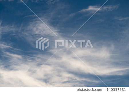 Sky cloud flow. Moving clouds under blue sky. Soft clouds drift across bright blue sky. Delicate cloud formations glide through vivid cobalt atmospheric backdrop Sky cloud flow. Moving clouds under blue sky. Soft clouds drift across bright blue sky. Delicate cloud formations glide through vivid cobalt atmospheric backdrop 140357381