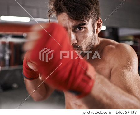Man, fist and ready for fighting in gym, fitness and topless for exercise and workout. Male person, bodybuilder and punching for challenge or practice, training and martial arts for competition Man, fist and ready for fighting in gym, fitness and topless for exercise and workout. Male person, bodybuilder and punching for challenge or practice, training and martial arts for competition 140357438