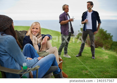 Friends, men and women with drinks for relax on grass in nature with happiness for holiday and vacation. People, smile and alcohol in countryside or lake for adventure, travel and bonding in forest Friends, men and women with drinks for relax on grass in nature with happiness for holiday and vacation. People, smile and alcohol in countryside or lake for adventure, travel and bonding in forest 140357567