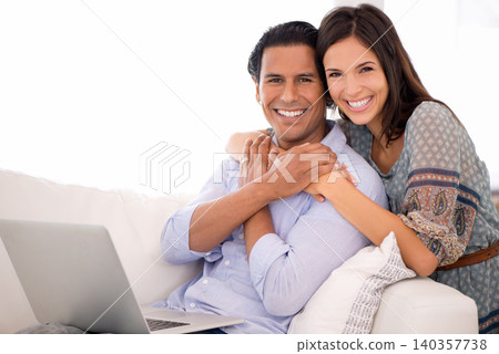 Portrait, hug and couple on sofa with laptop for internet, browse and search for movie subscription. Relax, happy woman and man on couch together on app for online streaming, love and entertainment 140357738