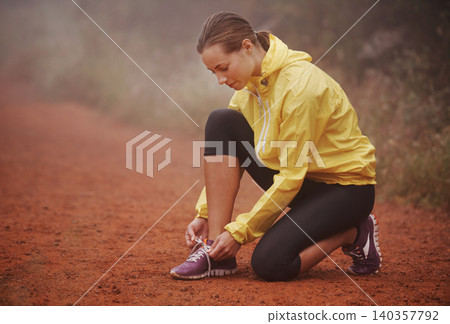 Running, shoelace and fitness woman in park for training, exercise or wellness in winter. Workout, sneakers or runner in nature for morning cardio preparation, sports or shoes check for marathon run Running, shoelace and fitness woman in park for training, exercise or wellness in winter. Workout, sneakers or runner in nature for morning cardio preparation, sports or shoes check for marathon run 140357792