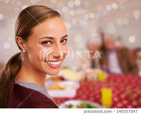 Portrait, Christmas and woman with her family, meal and relaxing with festive season and healthy dinner. Face, girl or people with social gathering or home with smile or Xmas with holiday food or joy Portrait, Christmas and woman with her family, meal and relaxing with festive season and healthy dinner. Face, girl or people with social gathering or home with smile or Xmas with holiday food or joy 140357847