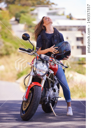 Woman, motorcycle and relax with helmet in city for ride, road trip or outdoor sightseeing in nature. Extreme female person, biker or rider chilling on motorbike or vehicle for transport or journey Woman, motorcycle and relax with helmet in city for ride, road trip or outdoor sightseeing in nature. Extreme female person, biker or rider chilling on motorbike or vehicle for transport or journey 140357857