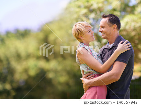 Love, smile and happy couple hug in park with trust, support or solidarity, security or bonding in nature. Commitment, eye contact or people embrace in forest for spring romance, fun or outdoor date Love, smile and happy couple hug in park with trust, support or solidarity, security or bonding in nature. Commitment, eye contact or people embrace in forest for spring romance, fun or outdoor date 140357942