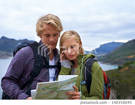 Couple, thinking and map for hiking, direction or location on outdoor adventure together in nature. Young man and woman reading tour or travel guide for route, path or destination on mountain hike Couple, thinking and map for hiking, direction or location on outdoor adventure together in nature. Young man and woman reading tour or travel guide for route, path or destination on mountain hike 140358045