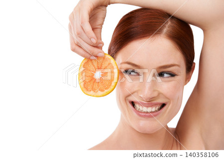 Studio, orange and woman with smile for skincare with fruit for natural facial, face and white background. Female person, happiness and joy for treatment with food with vitamin c for dermatology Studio, orange and woman with smile for skincare with fruit for natural facial, face and white background. Female person, happiness and joy for treatment with food with vitamin c for dermatology 140358106