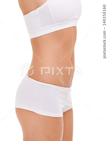 Body, beauty and woman in underwear for health, wellness and lose weight for care isolated on a white studio background. Panties, bra and stomach of young model, waist and abdomen with slim figure Body, beauty and woman in underwear for health, wellness and lose weight for care isolated on a white studio background. Panties, bra and stomach of young model, waist and abdomen with slim figure 140358160