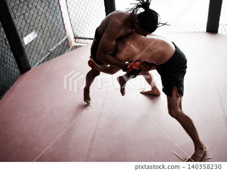 Fight, wrestling and men in cage for kickboxing competition, challenge and fitness with sports in gym. Match, strong fighter and resilience in exercise, sparring practice and power in battle together Fight, wrestling and men in cage for kickboxing competition, challenge and fitness with sports in gym. Match, strong fighter and resilience in exercise, sparring practice and power in battle together 140358230