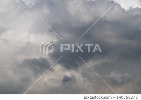 Layered sky formations indicating movement. Dynamic volumetric clouds suggestive of motion. Threedimensional cloud structures displaying turbulence and variety in scale Layered sky formations indicating movement. Dynamic volumetric clouds suggestive of motion. Threedimensional cloud structures displaying turbulence and variety in scale 140358278