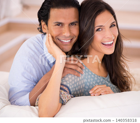 Smile, romance and portrait of couple on sofa for weekend bonding, embrace and connection in home. Love, support and trust in marriage, happy man and woman on couch with embrace, wellness and hug. Smile, romance and portrait of couple on sofa for weekend bonding, embrace and connection in home. Love, support and trust in marriage, happy man and woman on couch with embrace, wellness and hug. 140358318