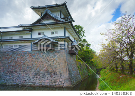 Kanazawa, Japan - Oct 6 2024, panoramic view of facade of Kanazawa Castle with the moat in the foreground, on a cloudy day, without people, at daytime, Kanazawa, Japan Kanazawa, Japan - Oct 6 2024, panoramic view of facade of Kanazawa Castle with the moat in the foreground, on a cloudy day, without people, at daytime, Kanazawa, Japan 140358368